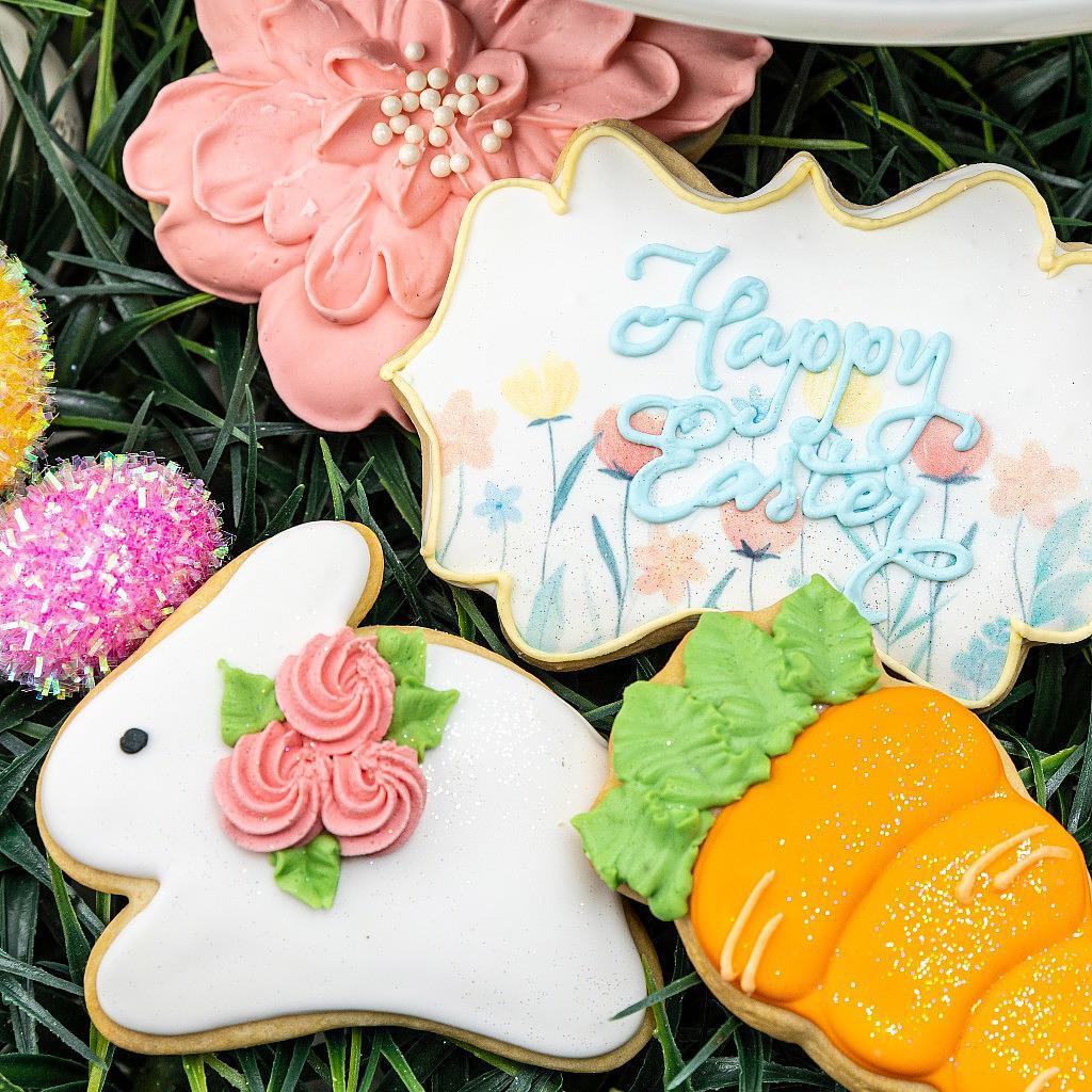 Easter sugar cookies shaped like bunnies, carrots, and flowers.