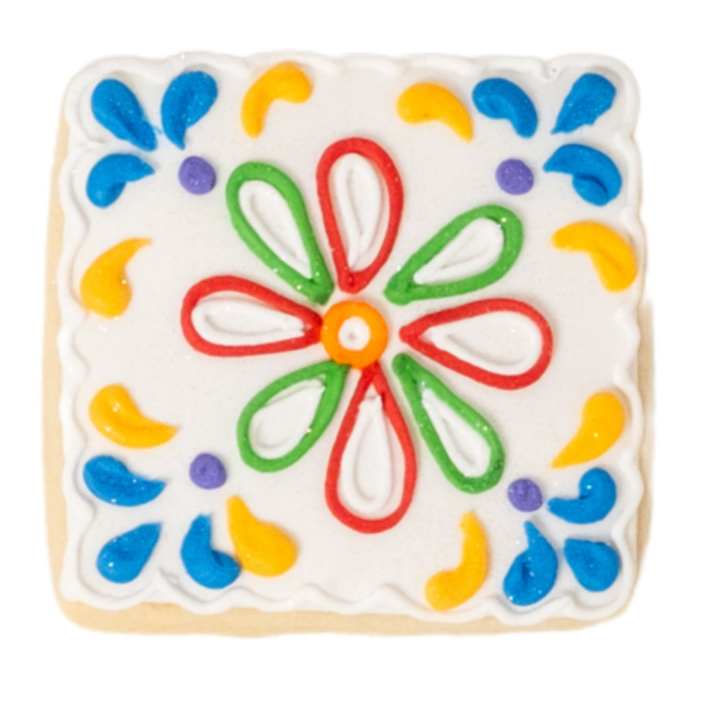 Cinco de Mayo cookie with colorful floral icing design.