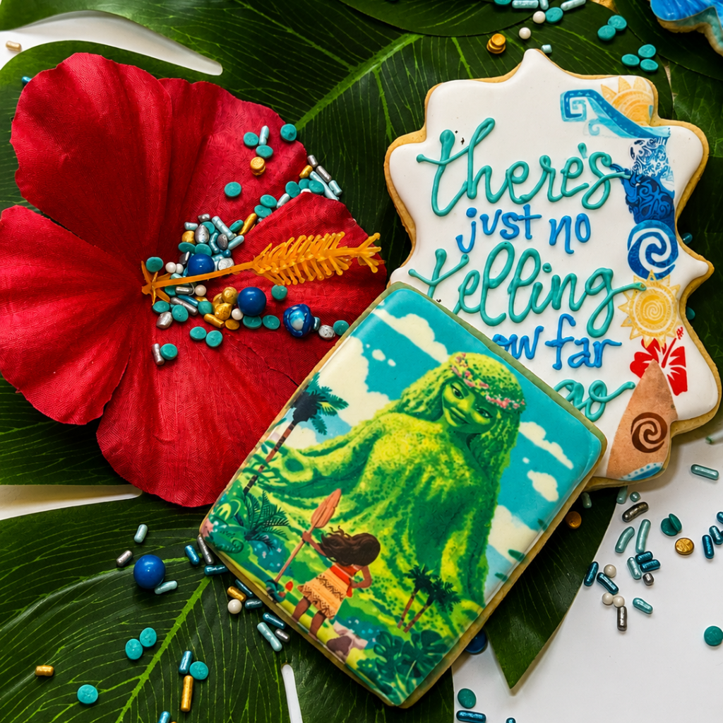 Assorted Moana cookies featuring Te Fiti and tropical designs.