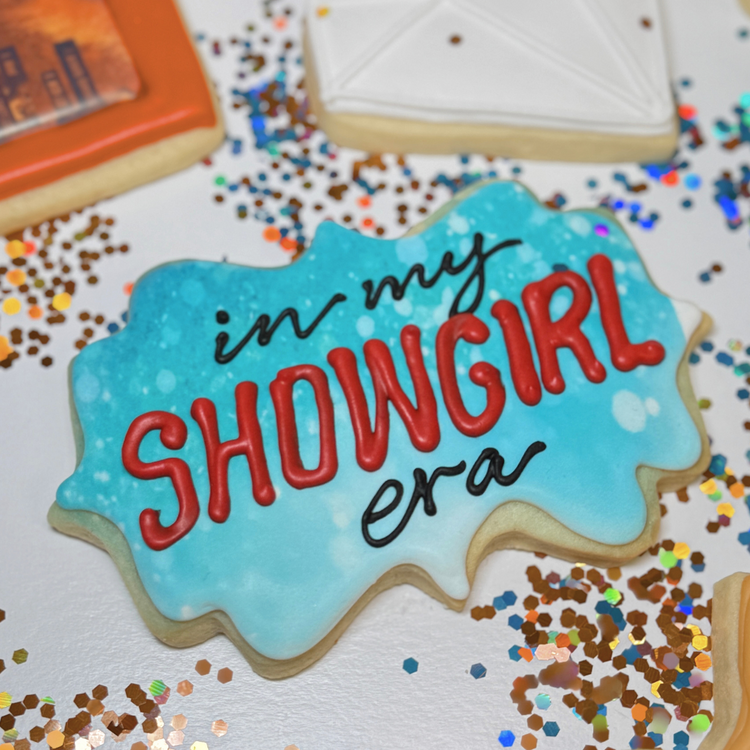Life of a Dough Girl assorted cookie with blue icing text.