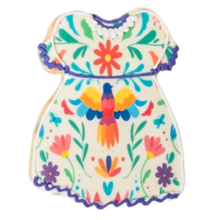 Cinco de Mayo cookie shaped like a dress with floral patterns.