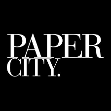 Paper City logo in white serif text on a black background.