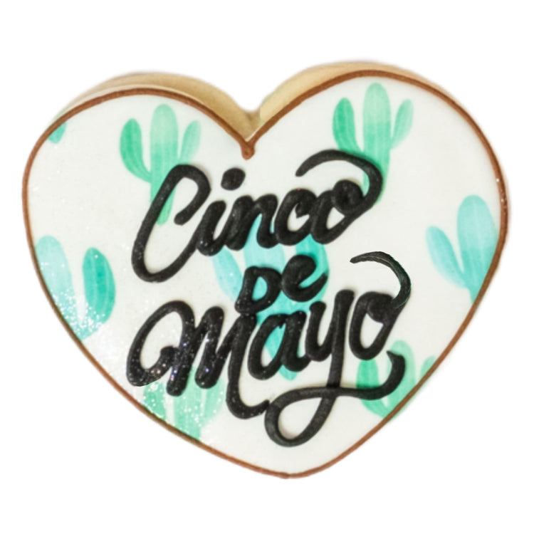 Heart-shaped Cinco de Mayo cookie with green cactus print