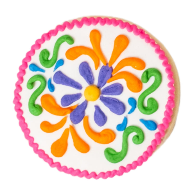 Cinco de Mayo cookie with colorful floral icing design.