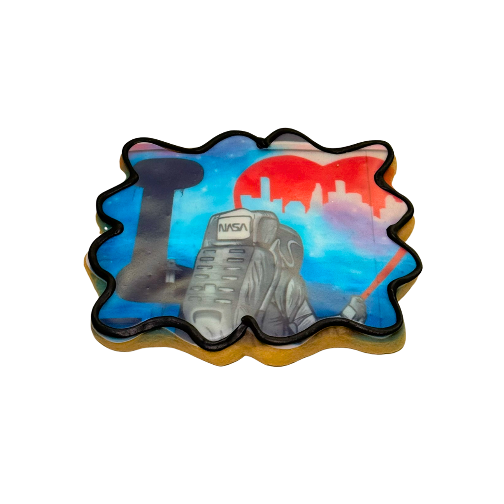 713 cookie with a colorful NASA astronaut graphic design