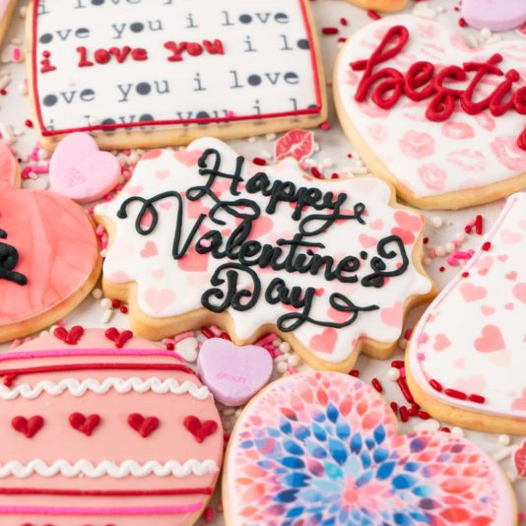 Assorted Valentine butter cookies with festive icing and sprinkles.