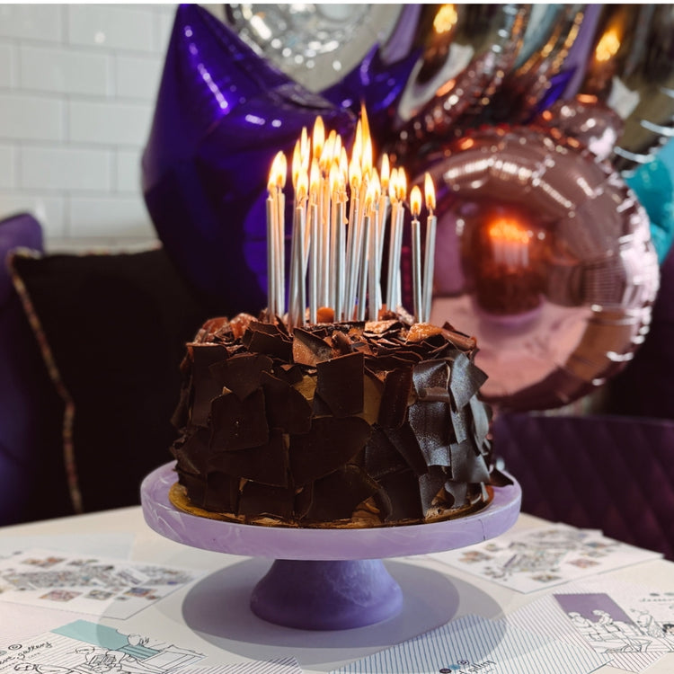 9-inch Cosmic Birthday Cake with chocolate shards on a purple stand