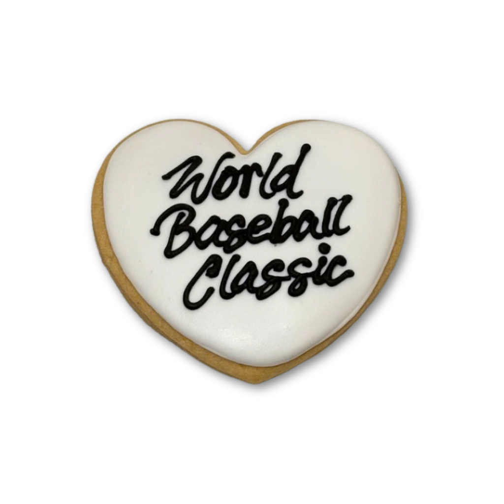 Heart-shaped World Baseball Classic cookie with white icing.