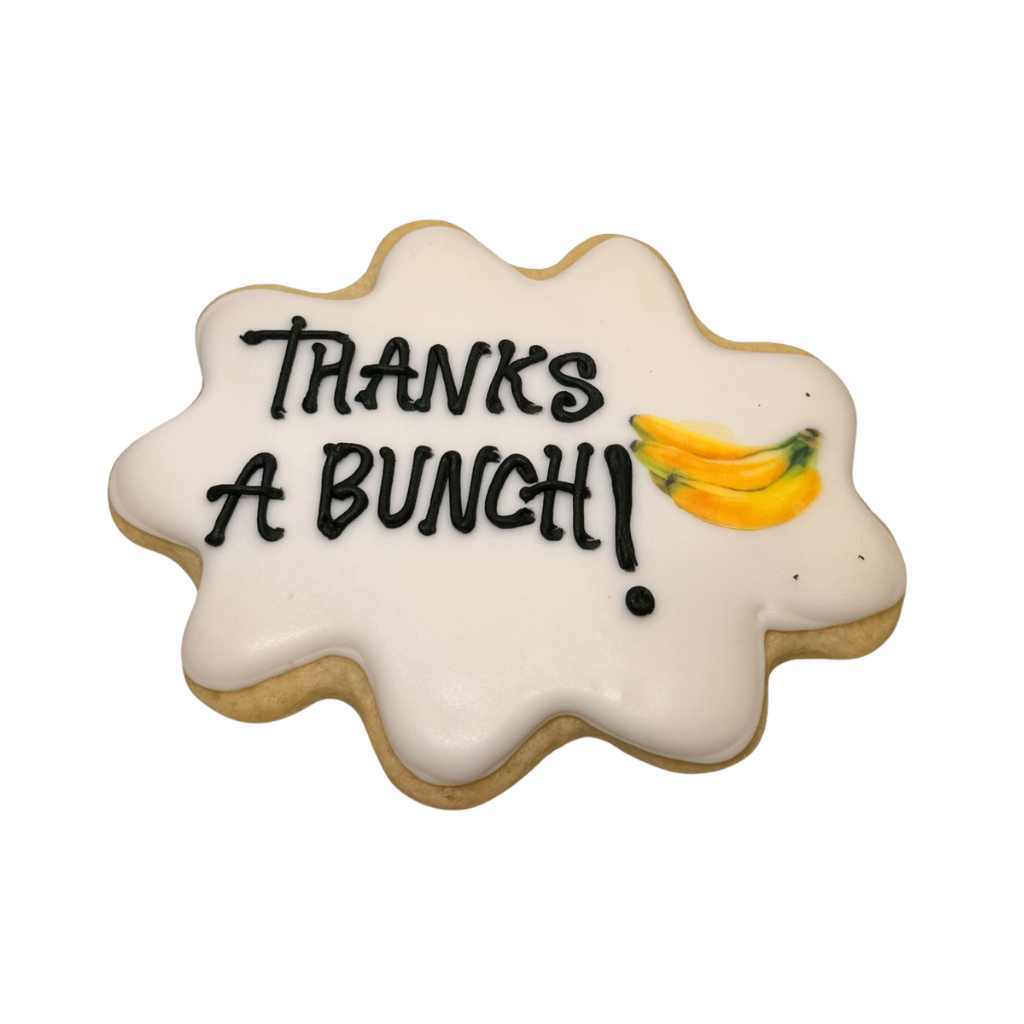 Boss's Week cookie with white icing and banana illustration.