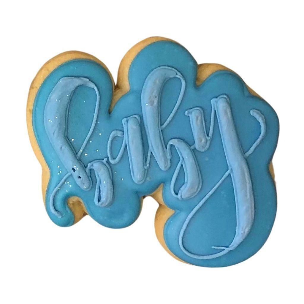 Blue baby plaque cookie with blue icing lettering