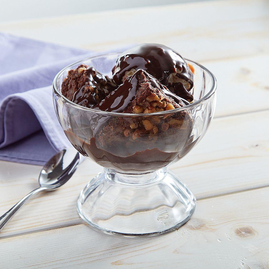 Brownie Batter Blowout Sundae in a glass dessert bowl
