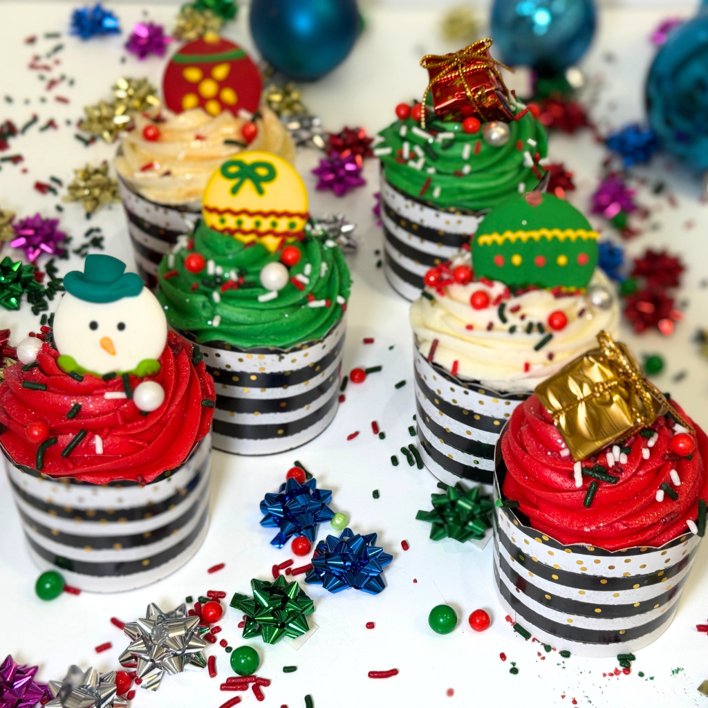 Christmas cupcakes with festive toppers in striped liners