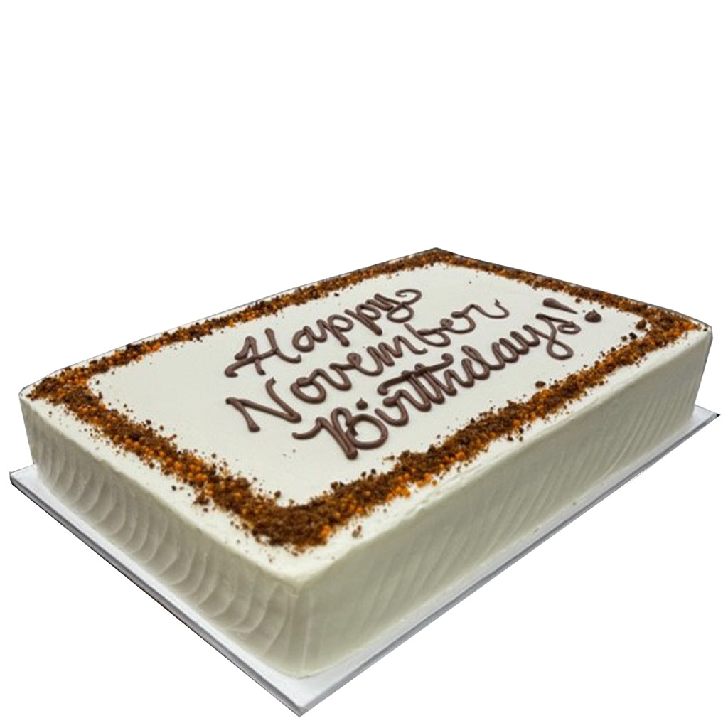 Carrot sheet cake with white frosting and birthday message.