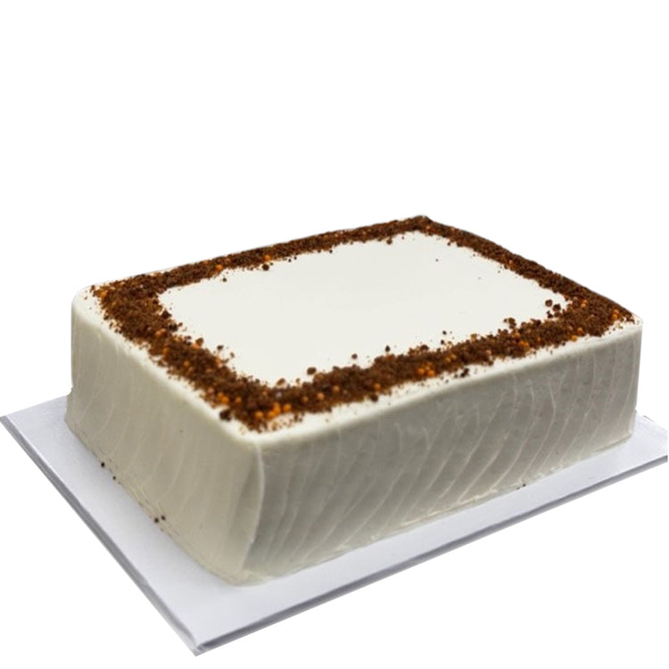 Carrot sheet cake with white frosting and brown crumb border