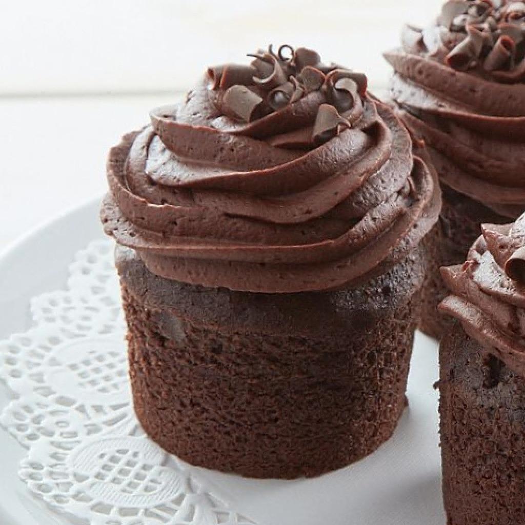 Assorted chocolate cupcakes with frosting and curls