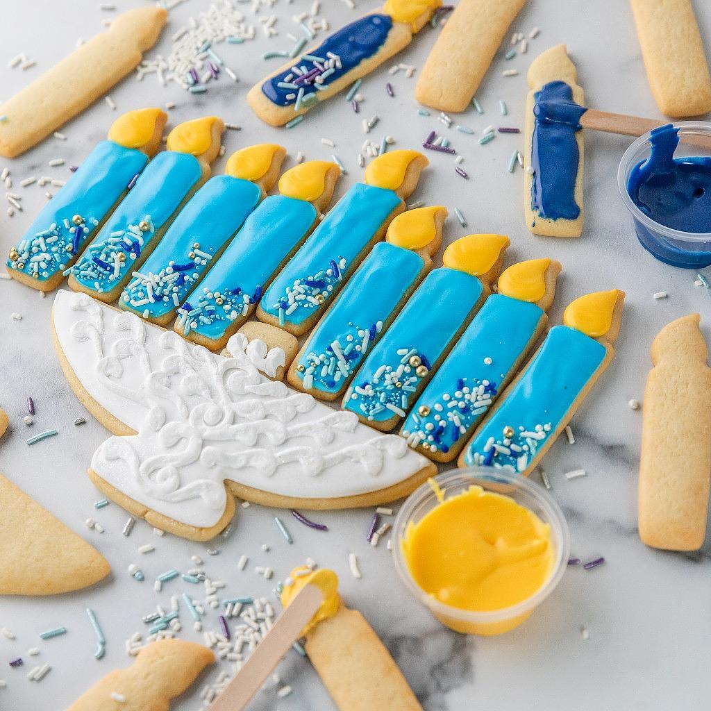 Menorah cookie decorating kit with blue and yellow icing.