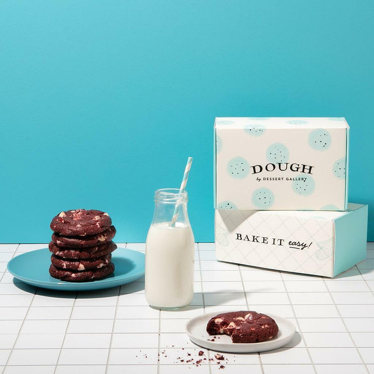 Red Velvet White Chocolate Dough cookies with a glass of milk.
