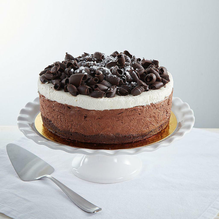 9-inch gluten-free mousse cake topped with chocolate curls