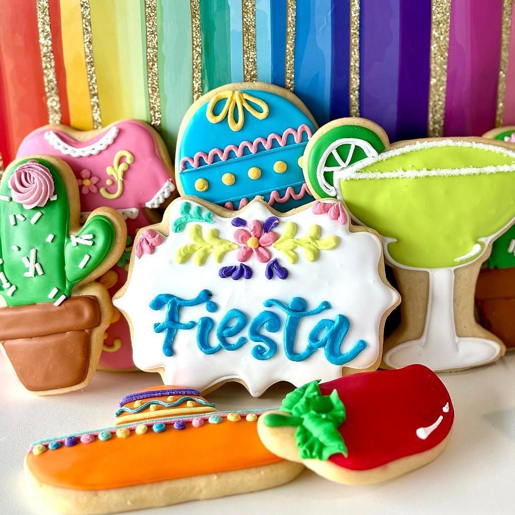 Assorted Cinco de Mayo cookies with colorful icing designs.