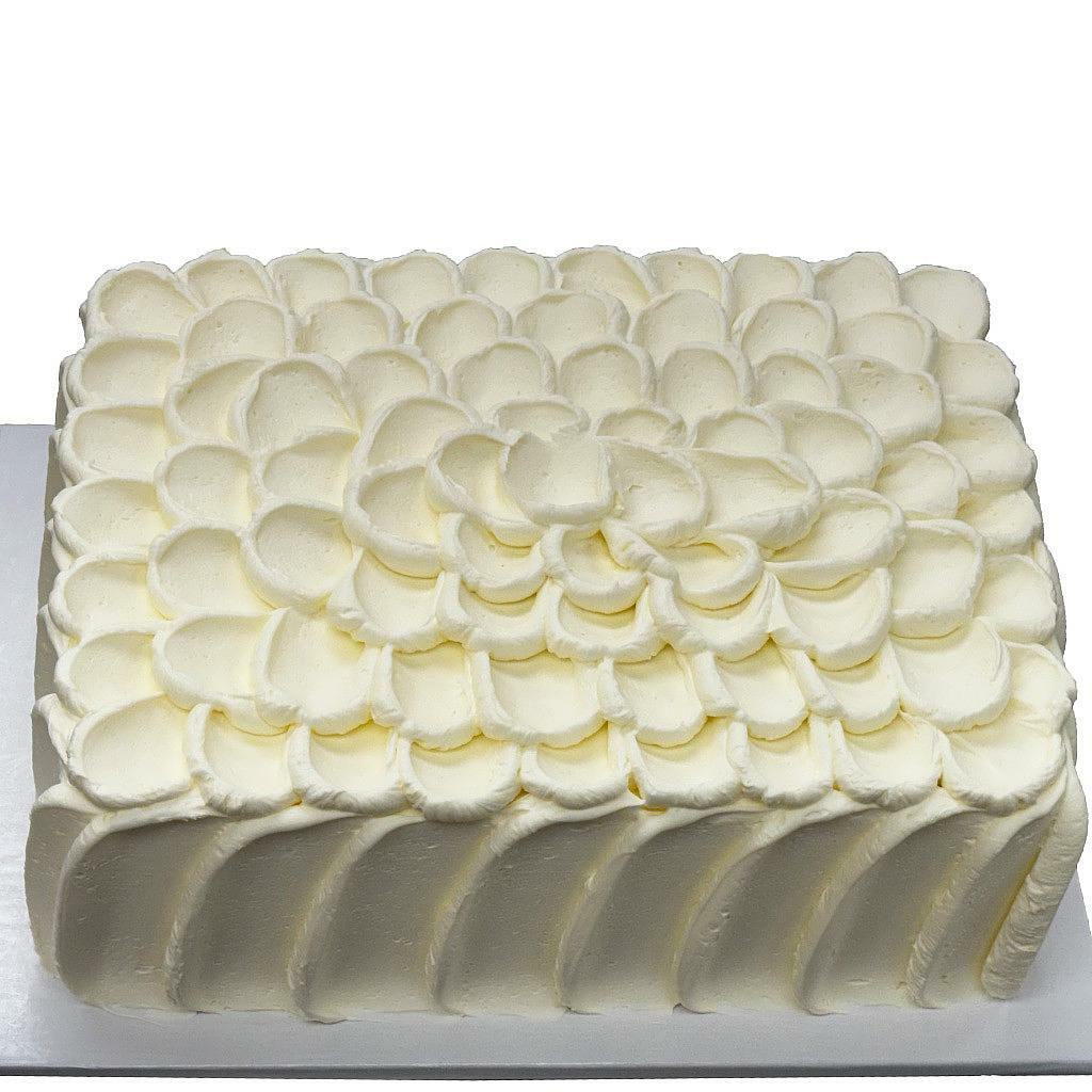 French Vanilla sheet cake with white petal frosting design