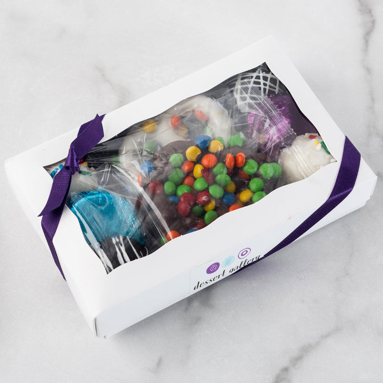 Chocolate Dipped Delights in a white gift box with purple ribbon