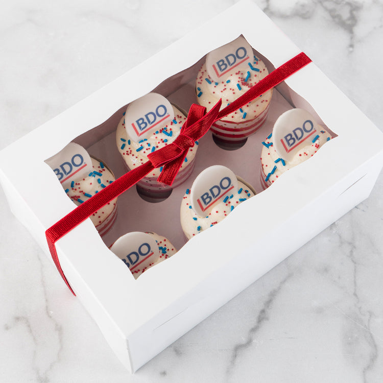 6-pack logo cupcakes in a white gift box with red ribbon