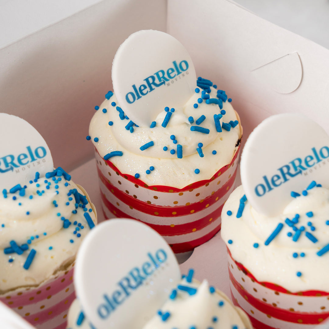 Photo & Logo cupcakes with blue sprinkles in striped liners.