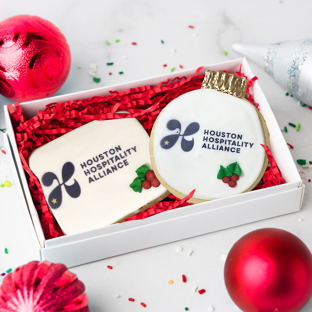 Houston Hospitality Alliance logo cookies in a gift box.
