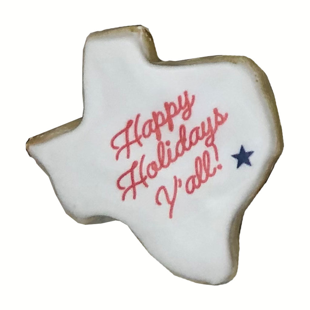 Texas-shaped cookie with Happy Holidays Y'all text and star.
