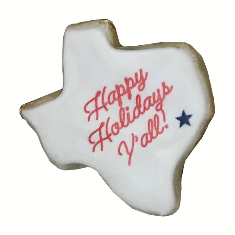 Texas-shaped cookie with Happy Holidays Y'all text and star.