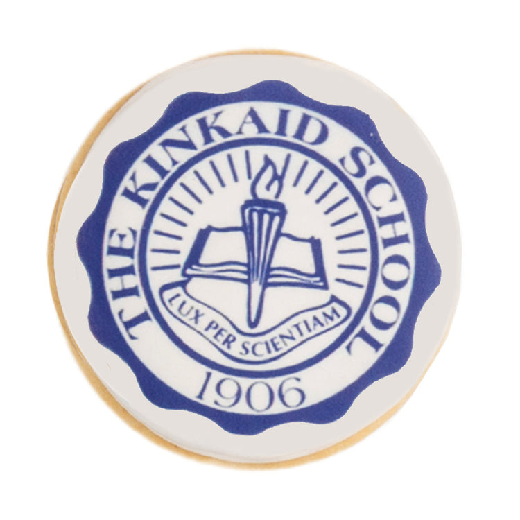 Round graduation cookie with blue Kinkaid School logo.