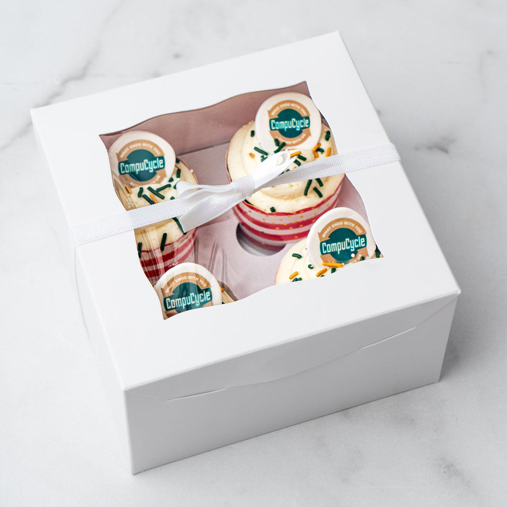 4-pack photo and logo cupcakes in a white window gift box.