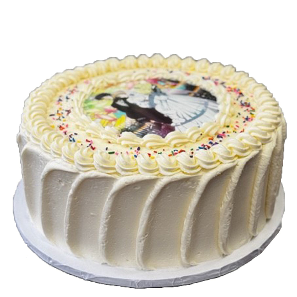 Round photo cake with white frosting and colorful sprinkles