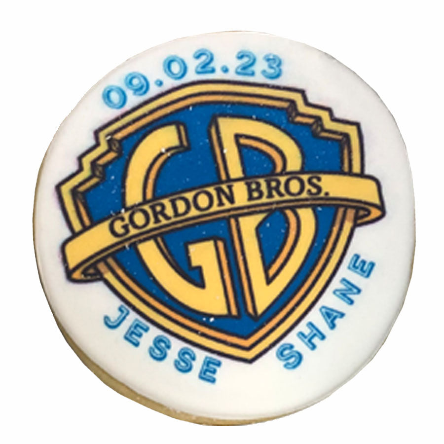 Round cookie with custom Gordon Bros logo and date print.