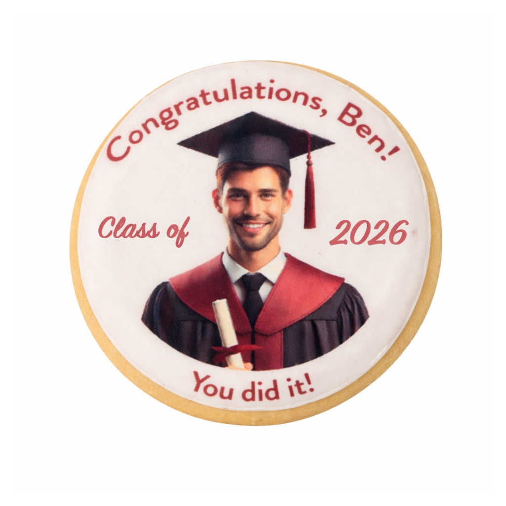 Round graduation cookie with a photo of a graduate in red robes.
