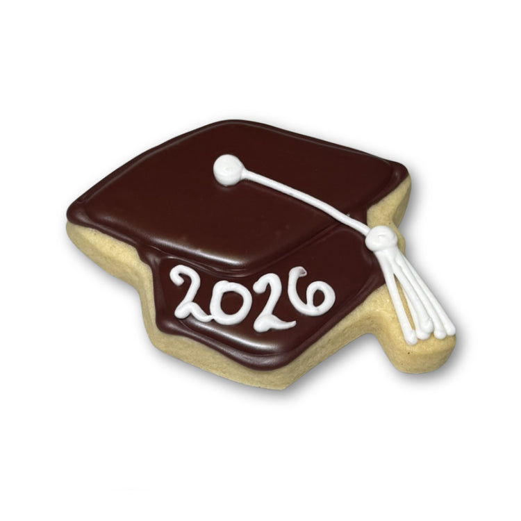 Graduation cap cookie with brown icing and 2026 text