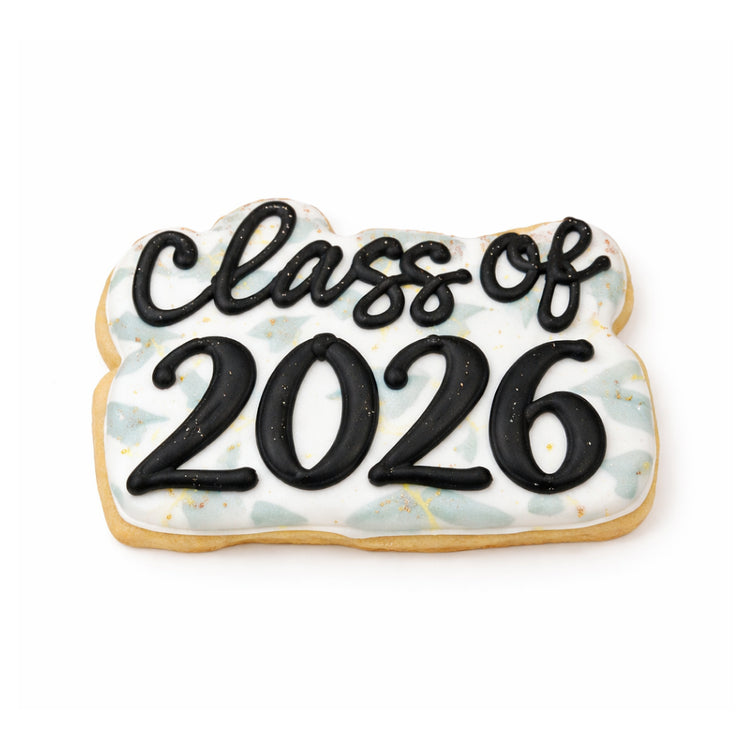 Class of 2026 cookie with black icing on a patterned background