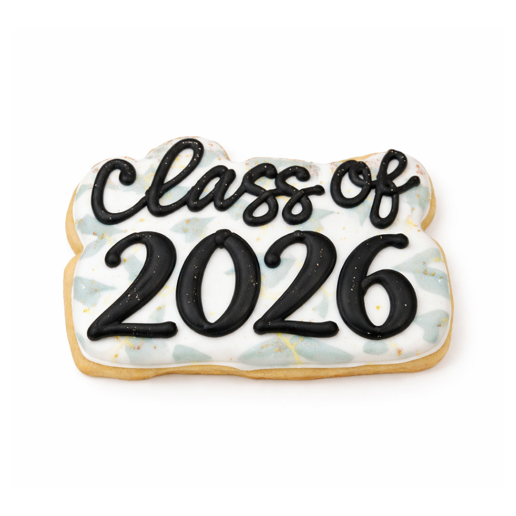 Class of 2026 cookie with black icing on a patterned background