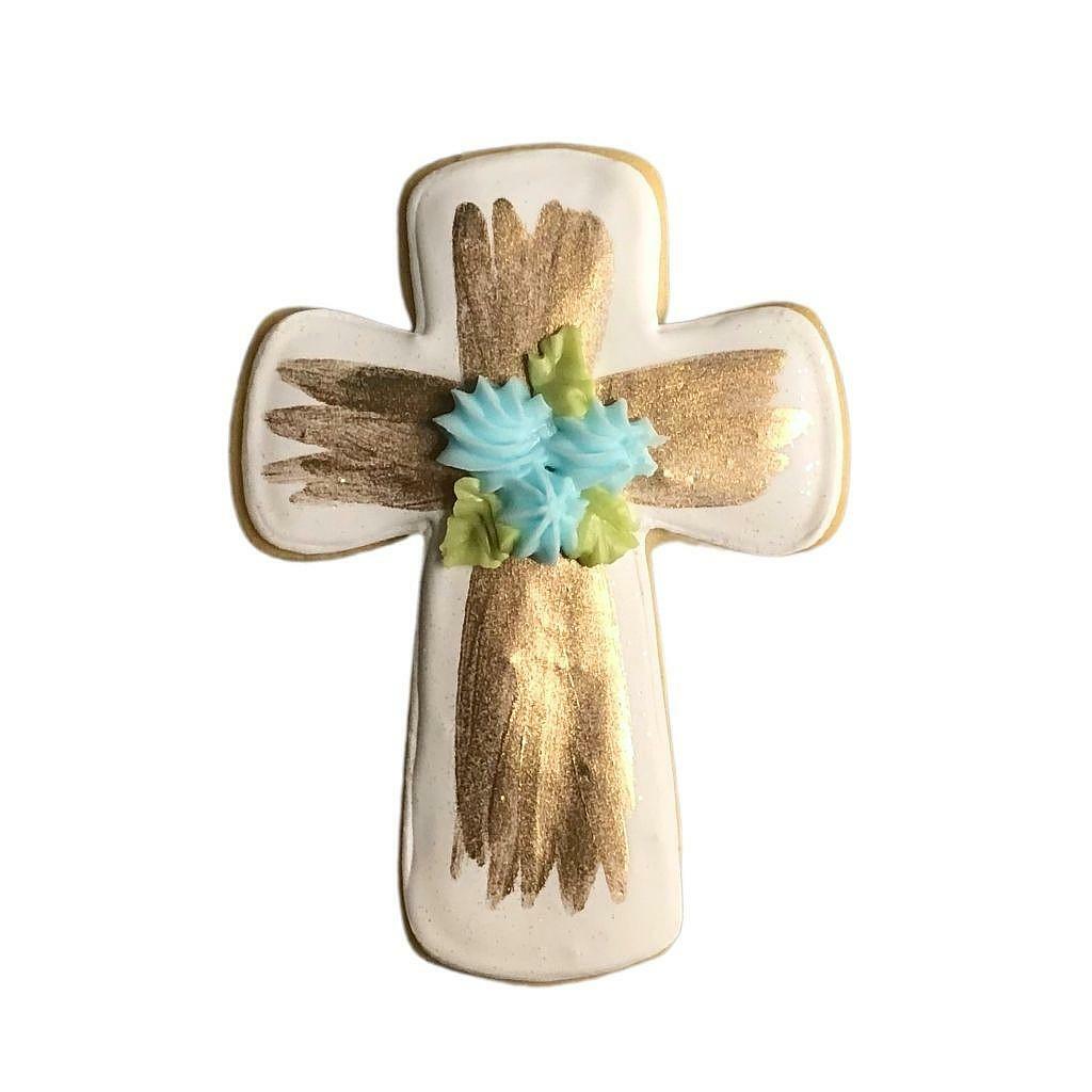 Gold brushed cross cookie with blue floral icing accents