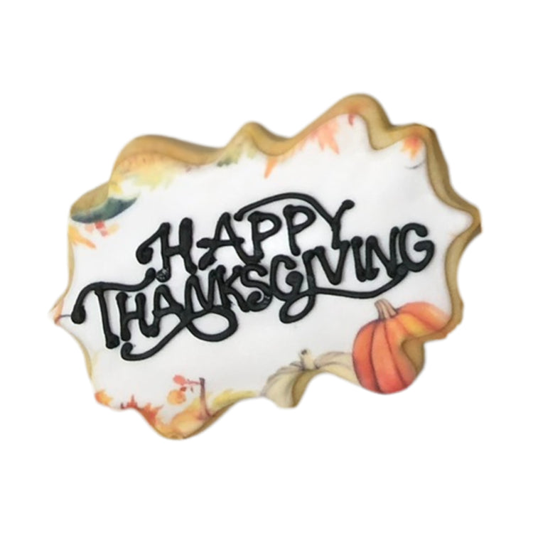 Thanksgiving cookie with Happy Thanksgiving icing and pumpkins
