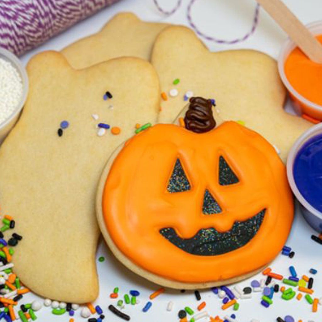 Halloween cookie decorating kit with pumpkin and ghost cookies