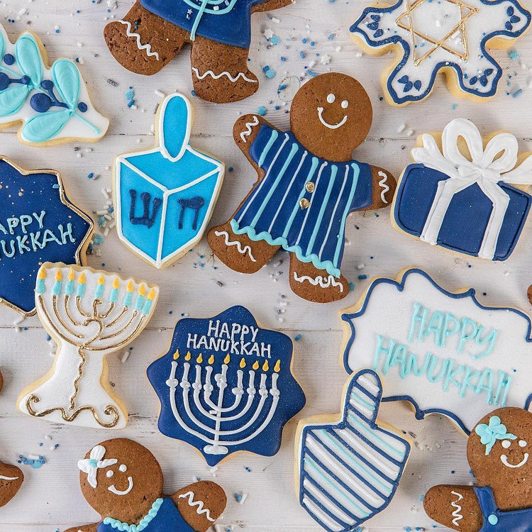 Hanukkah GingerPeople cookies with blue and white icing.