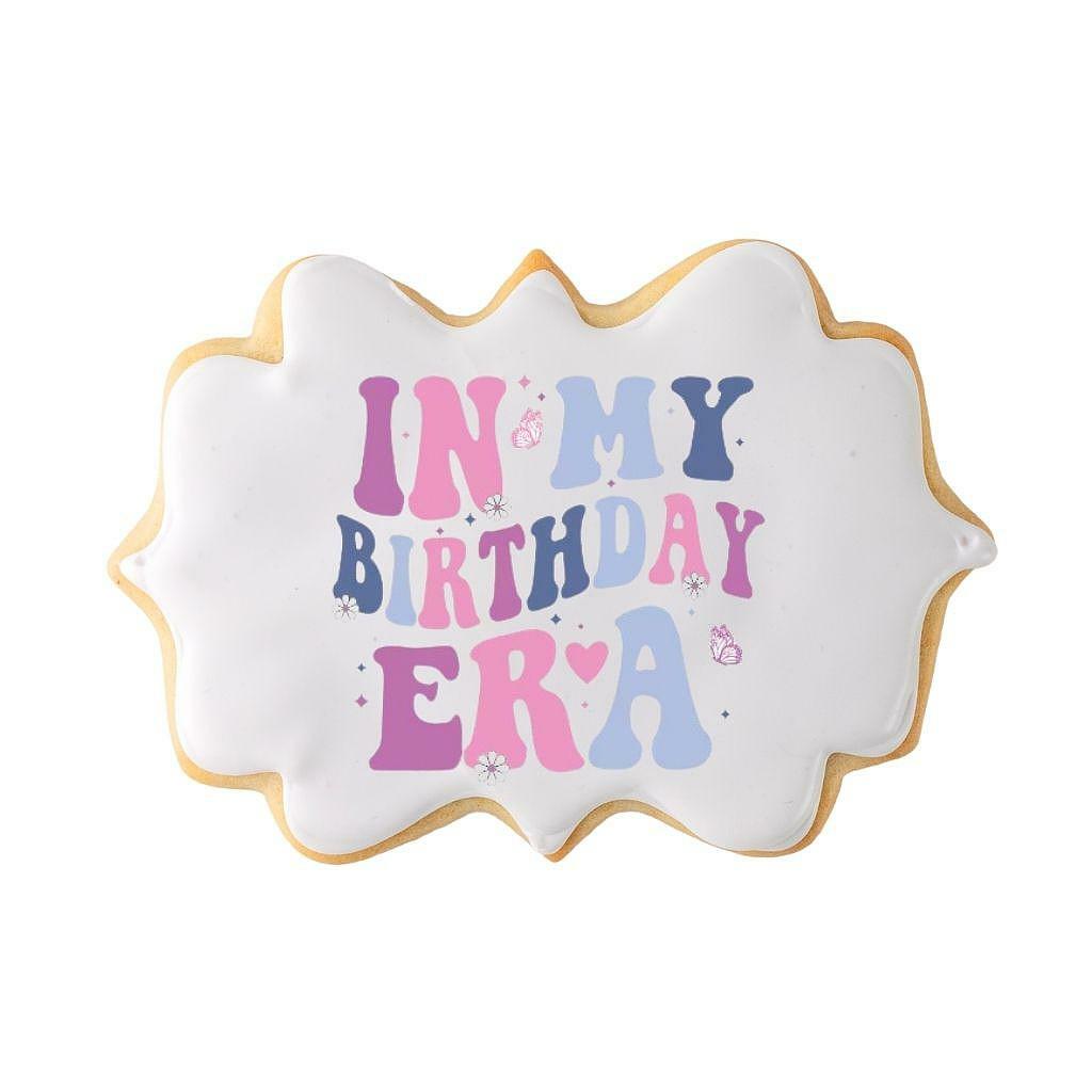 In My Birthday Era cookie with colorful text and icing.