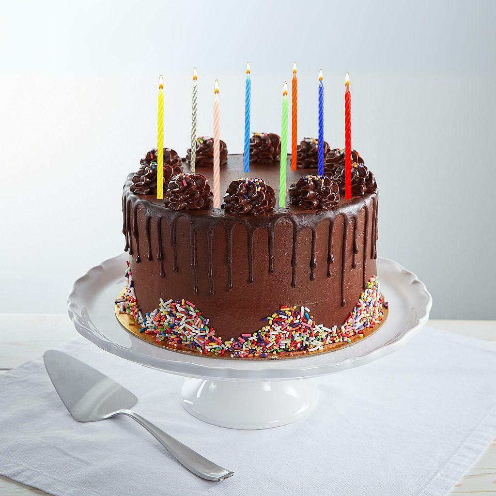 9-inch chocolate drip birthday cake with colorful candles