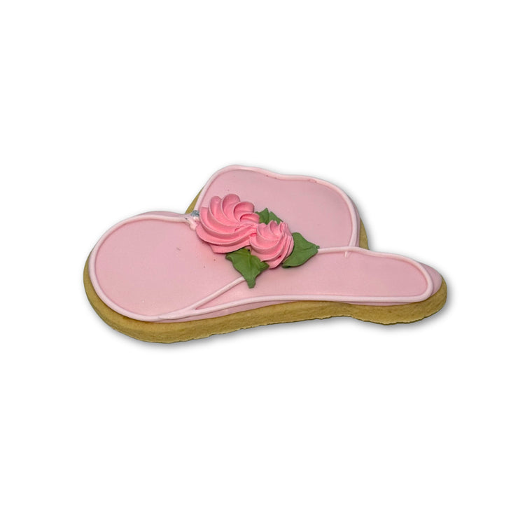 Kentucky Derby hat cookie with pink icing and rose detail.
