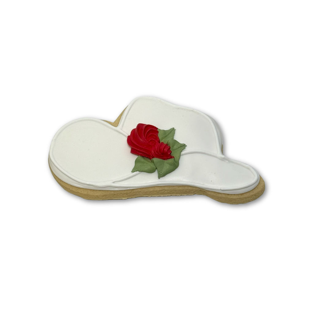 Kentucky Derby hat cookie with white icing and a red rose.