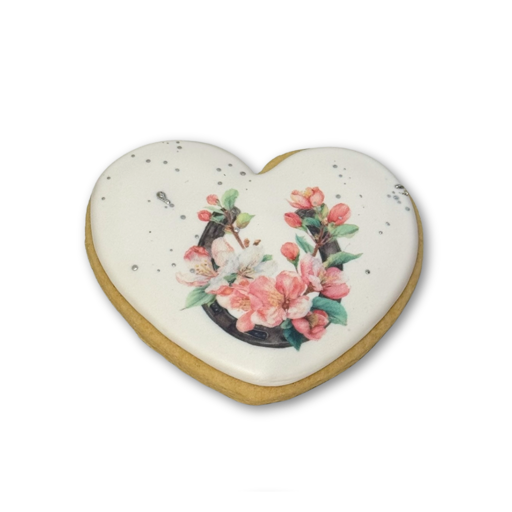 Heart-shaped Kentucky Derby cookie with floral horseshoe design.
