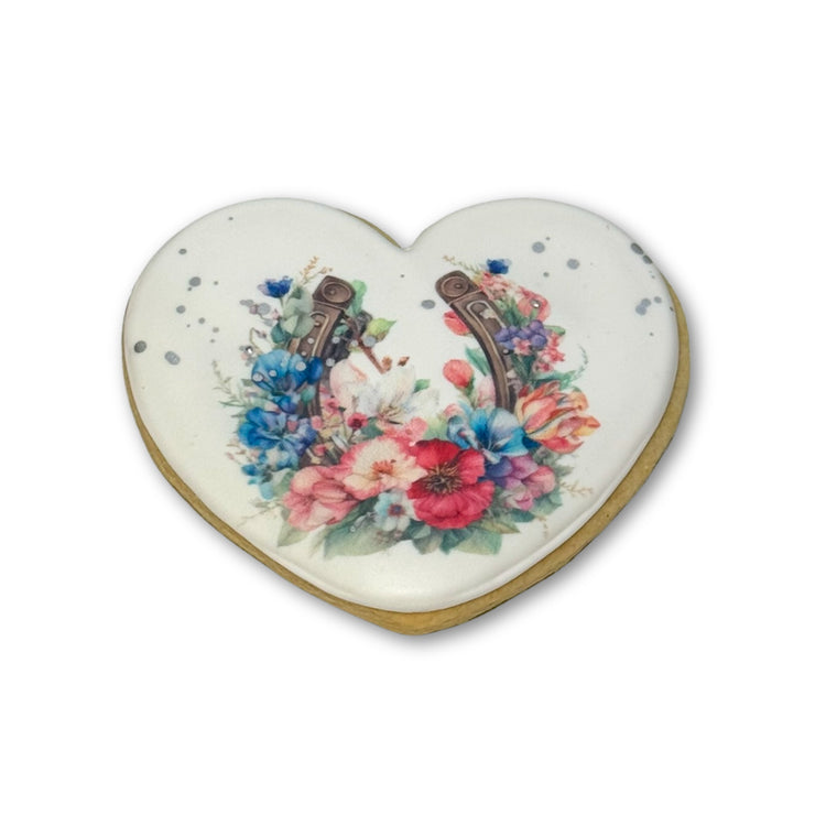 Kentucky Derby heart-shaped cookie with floral horseshoe.