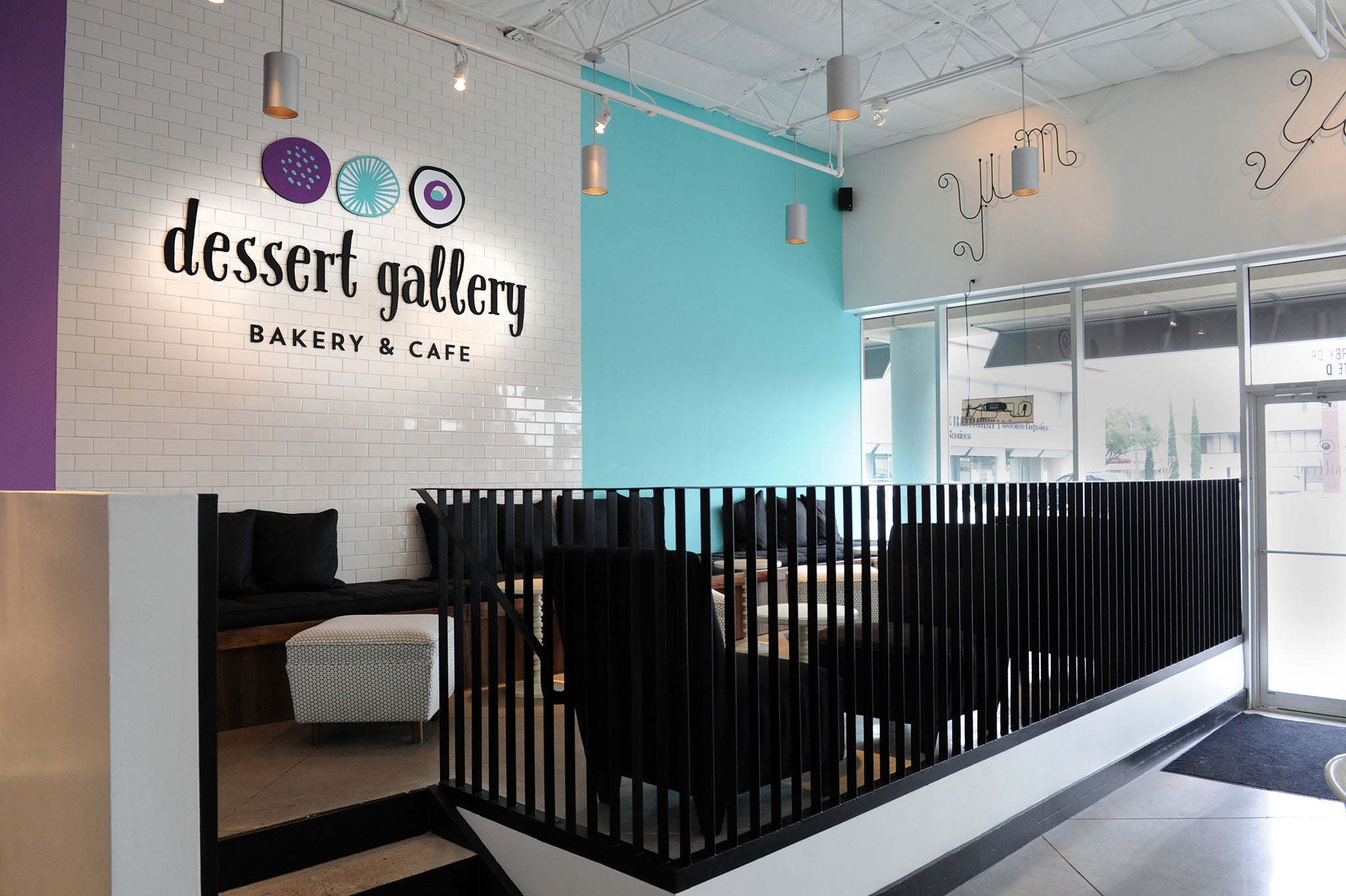 Dessert Gallery bakery and cafe interior with modern seating.