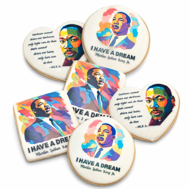 Assorted Martin Luther King cookies with colorful pop art designs.